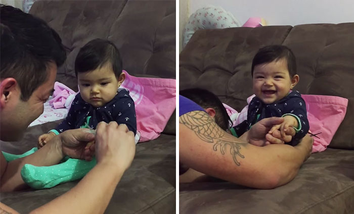 Malé bábätko predstiera plač pri strihaní nechtov, keď jej ich chce otecko ostrihať